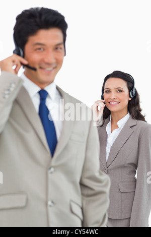 Sorridente supporto clienti dipendenti Foto Stock