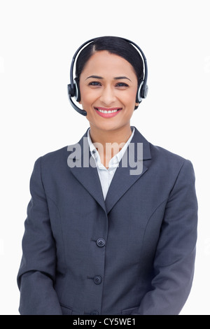 Close up sorridente servizio telefonico dipendente Foto Stock