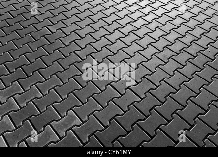 Parte della pavimentazione in calcestruzzo in bianco e nero Foto Stock