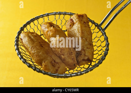 Frittelle di banane fritte banane in pastella Foto Stock