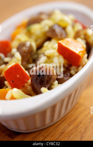 Risotto con zucca e castagne e mele cotogne. Foto Stock