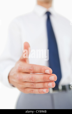 Close-up di un uomo in una tuta dando la sua mano Foto Stock