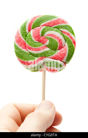 Luminose lollipop candy in mano Foto Stock