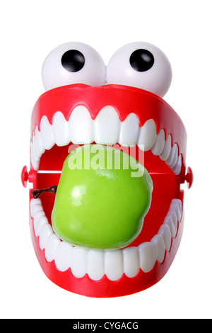 Denti di chattering Toy con Apple Foto Stock