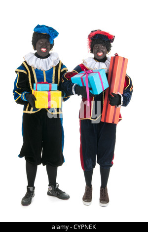 Caratteri olandese come black petes per tipiche Sinterklaas vacanze con presenta isolate su sfondo bianco Foto Stock