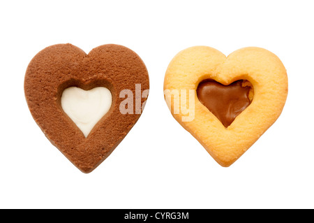 In casa a forma di cuore i cookie su sfondo bianco Foto Stock