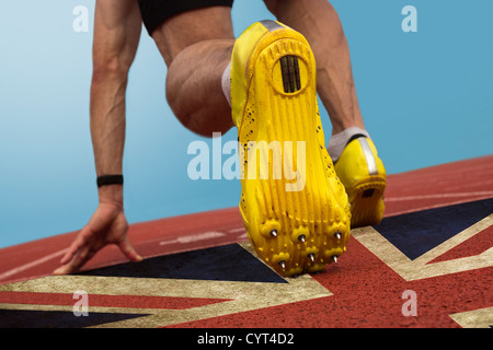 Sprinter con stampato bandiera britannica sulla superficie di tartan Foto Stock