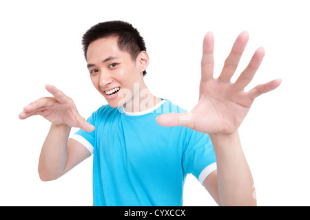 Gioiosa giovane uomo gesti con le mani Foto Stock
