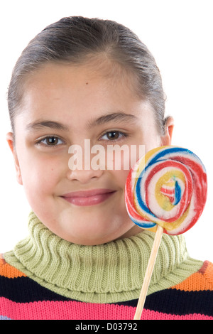 Adorabile ragazza con un lecca-lecca su un su sfondo bianco Foto Stock