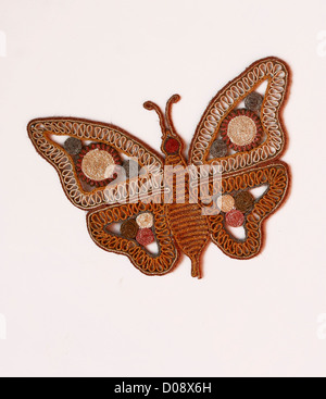 Una Farfalla pattern design artigianato sulla parete Foto Stock