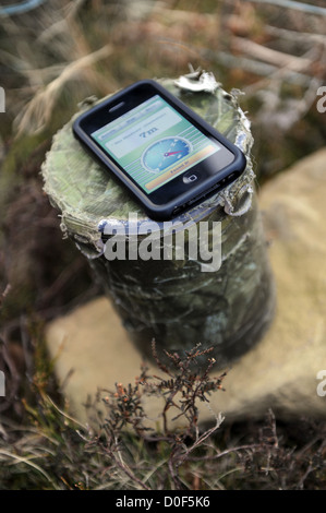 Geocache con iphone. Foto Stock