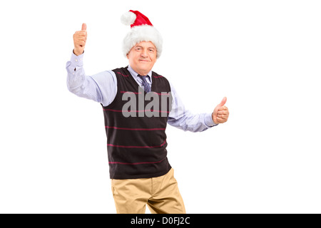 Una felice coppia gentiluomo con cappello di Natale dando pollice in alto isolato su sfondo bianco Foto Stock