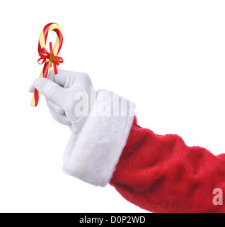 Santa Claus mano che tiene un vecchio Candy Cane con un nastro e le campane. Isolato su bianco, della mano e del braccio solo. Foto Stock