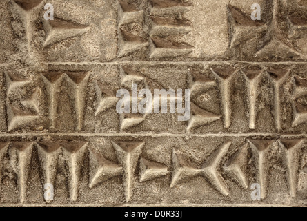 Il cuneiforme scrittura antica su sfondo di pietra Foto Stock