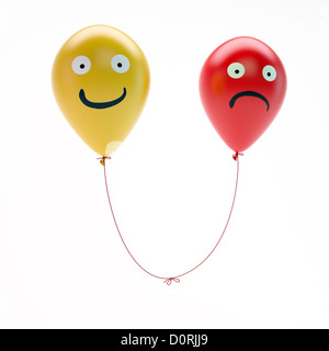 Triste e felice di palloncini Foto Stock