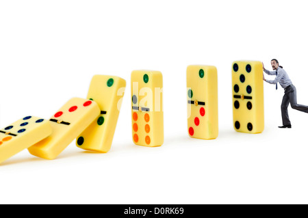 Imprenditore e domino isolato sul bianco Foto Stock