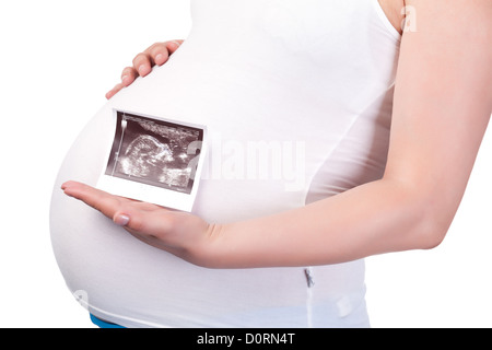 Donna incinta il ventre con immagine ad ultrasuoni Foto Stock