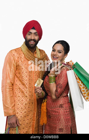 La religione sikh giovane azienda borse per lo shopping Foto Stock