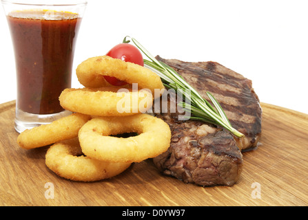 Bistecca e anelli di cipolla Foto Stock