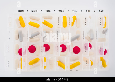 Porzioni di pillole in agenda elettronica Foto Stock