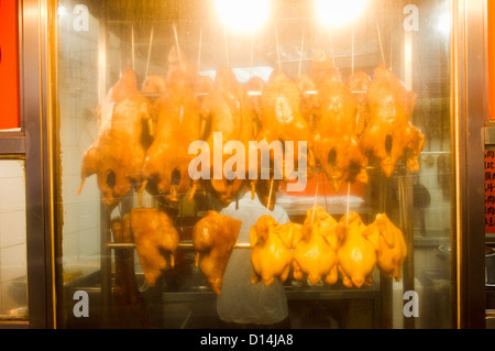 Appendere l'oca arrosto, anatra e pollo in hong kong ristorante. Foto Stock