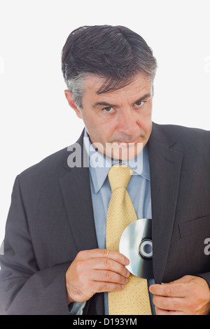 Imprenditore a rubare un disco compatto Foto Stock