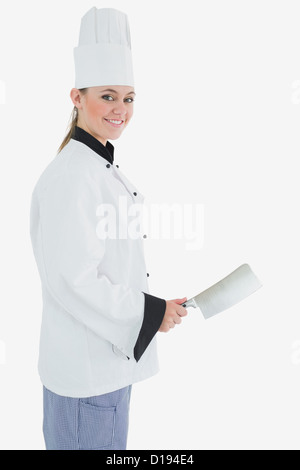 Ritratto di donna chef con carne cleaver Foto Stock
