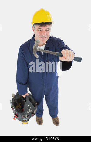 Coppia meccanico con un martello carring borsa portautensili Foto Stock