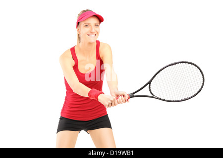 Una giovane donna giocando a tennis isolati su sfondo bianco Foto Stock