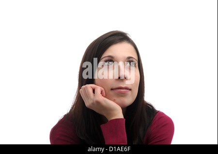 Ritratto di giovane donna con un look sognante sul suo volto, isolati su sfondo bianco Foto Stock