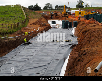 Grandi di acqua sotterranea camera di deposito cassa in plastica del sistema urbano sostenibile sistema di drenaggio saponata per la nuova autostrada schema UK Foto Stock