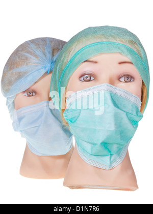 Due donne medico dummy indossando capi tessili cappuccio chirurgica e medica maschera di protezione isolati su sfondo bianco Foto Stock