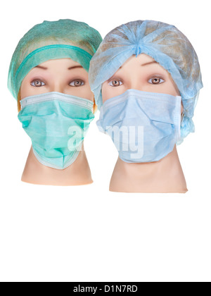 Due donne manichino medico indossando capi tessili cappuccio chirurgica e medica maschera di protezione isolati su sfondo bianco Foto Stock