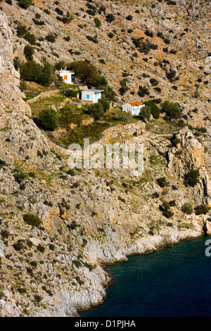 La piccola cappella con alberi da mare, Vathi, Kalymnos, Grecia Foto Stock