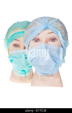 Due donne medico manichino indossare capi tessili cappuccio chirurgica e medica maschera di protezione isolati su sfondo bianco Foto Stock