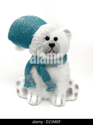 Orso polare in blu cappello e sciarpa Foto Stock