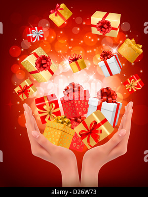 Holiday sfondo con mani confezioni regalo. Concetto di dare presenta. Foto Stock