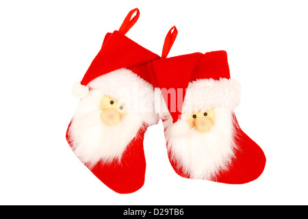 Rosso calze di Natale con Santa faccia isolata contro uno sfondo bianco con tracciato di ritaglio Foto Stock