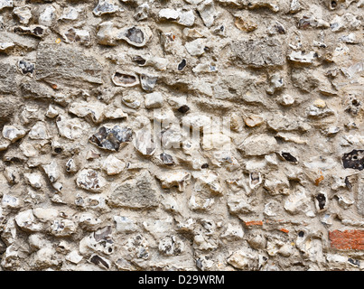 Primo piano di una antica pietra focaia e muratura muro di castello Foto Stock