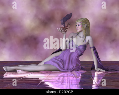 Una bella fata detiene un piccolo drago pet nella sua mano. Foto Stock
