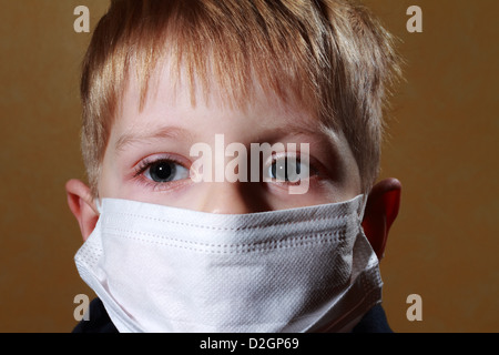 Little Boy in medicina maschera healthcare Foto Stock