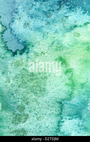 Colorate colore acqua versando su di una carta un overflow di sfondo Foto Stock