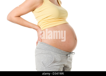 Incinta donna del ventre del mal di schiena Foto Stock