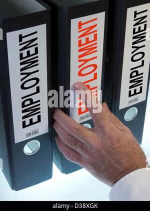 Immagine simbolo,mano che puntano a una cartella di file denominata occupazione Foto Stock