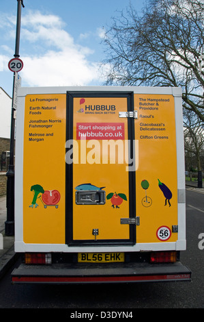 Retro del frastuono furgone commerciale utilizzato per fornire cibo locale da negozi indipendenti, Highbury, London Borough di Islington England Regno Unito Foto Stock