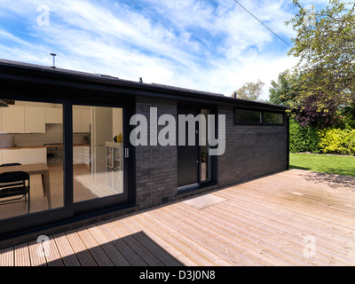 Hollins Lane, Marple Bridge, Regno Unito. Architetto: Roz Barr architetti, 2012. Elevazione laterale con punto di ingresso. Foto Stock