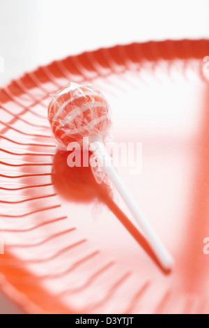 Lecca-lecca e piastra di plastica Foto Stock