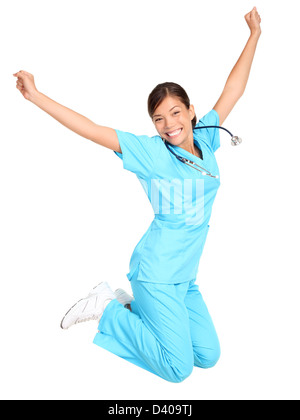 I giovani medici professionali femmina / studente salti di gioia isolati su sfondo bianco Foto Stock