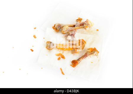 Osso del pollo sul tessuto di sfondo della carta Foto Stock