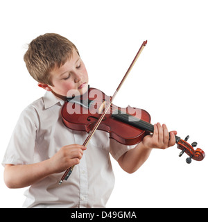 Un 9 anno vecchio ragazzo giocando il suo violino strumento musicale Foto Stock